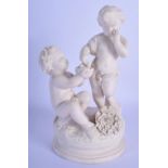 A 19TH CENTURY EUROPEAN PARIAN WARE FIGURE OF TWO PUTTI modelled feeding a chick. 18 cm cm high.