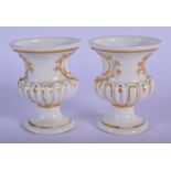 19TH C. MEISSEN PAIR OF URNS WITH MOULED CARTOUCHES WITH GILDED HIGHLIGHTS. 7cm high