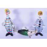 A pair of Murano glass decanters in the form of clowns together with a wine pourer in the form of a