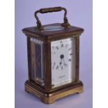 A MINIATURE FRENCH BRASS CARRIAGE CLOCK. 7.5 cm high inc handle.