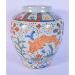 A Chinese porcelain Wucai vase decorated with carp and algae 26cm.