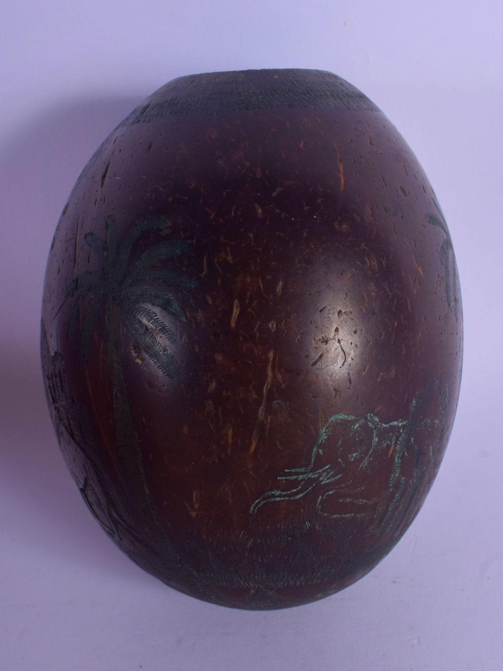 A 1920S SOUTH AMERICAN CARVED COCONUT BUGBEAR SHELL decorated with figures in various pursuits. 11 c - Image 2 of 5
