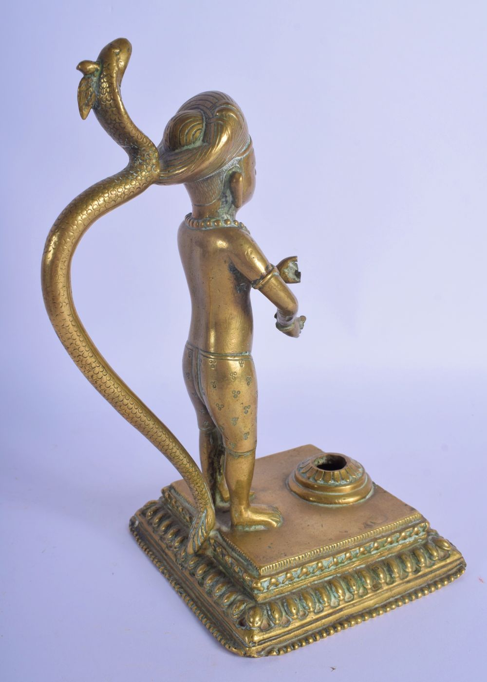 A CHARMING EARLY 19TH CENTURY INDIAN BRONZE FIGURE OF A BOY modelled with a serpent upon a square pl - Image 3 of 7