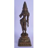 AN 18TH/19TH CENTURY INDIAN BRONZE FIGURE OF A STANDING BUDDHIST DEITY modelled with one hand raised