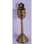 AN UNUSUAL GEORGE III BRASS AND COPPER OIL LAMP BURNER modelled with mask heads and scrolling motif