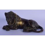 A 17TH/18TH CENTURY EUROPEAN BRONZE FIGURE OF A RECLINING LION modelled looking solemn. 18 cm x 9 cm