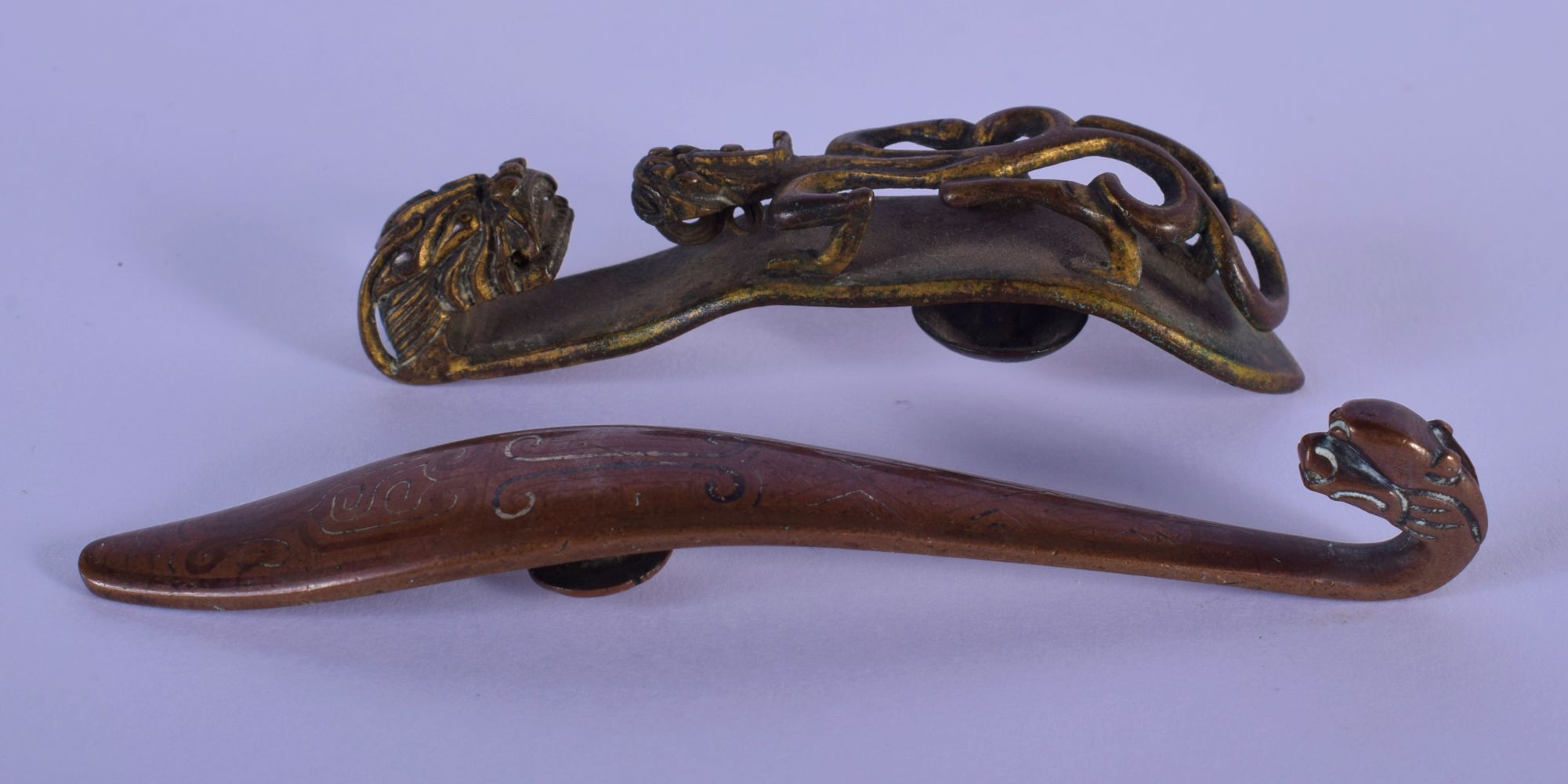 TWO 17TH/18TH CENTURY CHINESE MIXED METAL BELT HOOKS one with silver inlay. Largest 9.5 cm long. (2)
