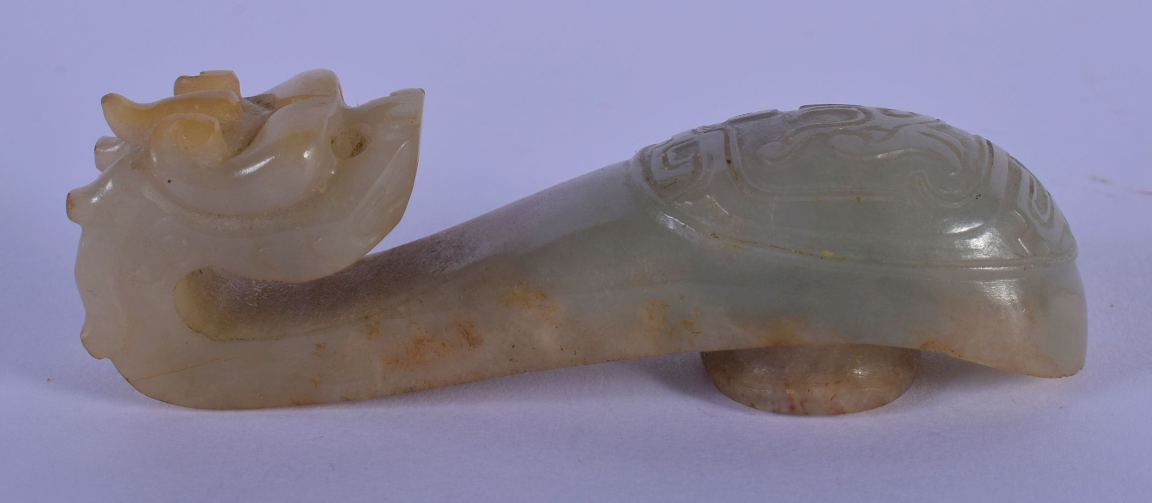 A 19TH CENTURY CHINESE CARVED GREENISH WHITE JADE BELT HOOK Qing, overlaid with an oval motif. 8.5 c