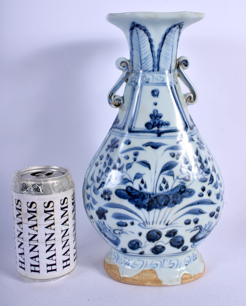 A CHINESE TWIN HANDLED YUAN STYLE BLUE AND WHITE VASE 20th Century. 29 cm high.