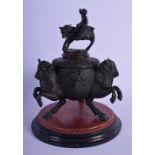 A 19TH CENTURY EUROPEAN GRAND TOUR BRONZE INKWELL AND COVER modelled with leaping bull. 18 cm x 13 c