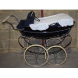 A mid century Silver cross pram with matching accessory bag 94 x 135 x 55cm