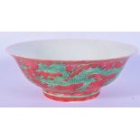 A red ground Chinese porcelain bowl decorated with a dragon 7 x 19cm.