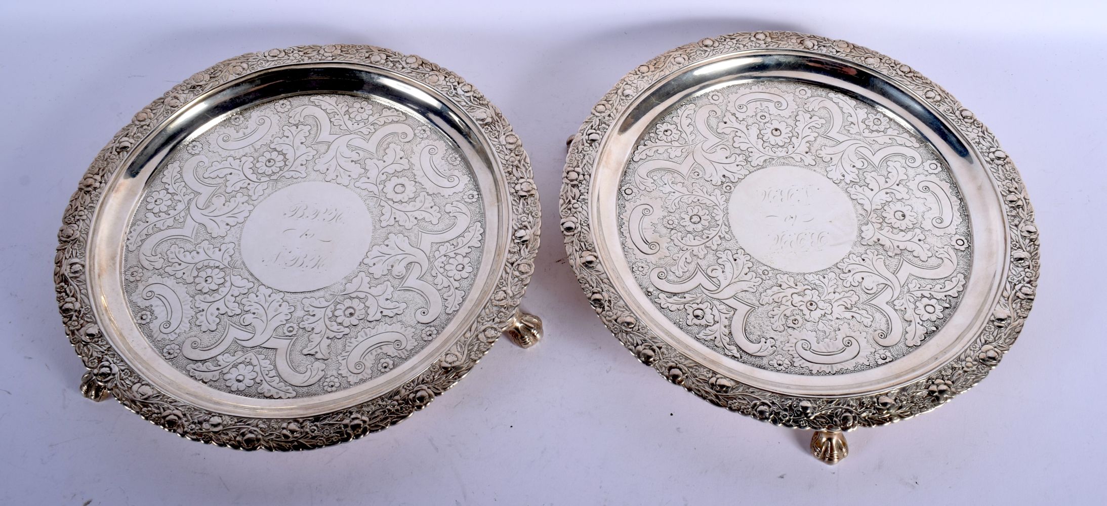 A PAIR OF 19TH CENTURY CONTINENTAL SILVER SALVES by Welles Celston & Co. 1144 grams. 24 cm wide.