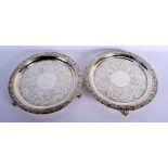 A PAIR OF 19TH CENTURY CONTINENTAL SILVER SALVES by Welles Celston & Co. 1144 grams. 24 cm wide.