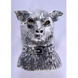 A STERLING SILVER DOG BROOCH WITH GEM SET EYES. 2.9cm x 2.4cm, weight 10g