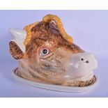 AN ANTIQUE CONTINENTAL BOVINE COW HEAD SERVING DISH AND COVER of naturalistic form. 25 cm x 20 cm.
