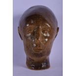 AN UNUSUAL CONTINENTAL STONEWARE SCULPTURE OF MALE possibly American. 14 cm x 8 cm.