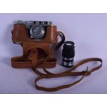 A LEATHER CASED LEICA CAMERA together with a lens. (2)