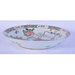 A Chinese porcelain Famille Verte dish decorated with birds and foliage .5 x 28.5cm.