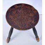 An antique military Scottish pokerwork Stool carved with the motto of the three Scottish army regime