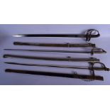 AN ANTIQUE NAVAL SWORD together with two others. Largest 100 cm long. (3)
