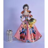 A 1950S ITALIAN CERAMIC FIGURE OF A STANDING FEMALE GYPSY GIRL modelled holding an urn, painted with