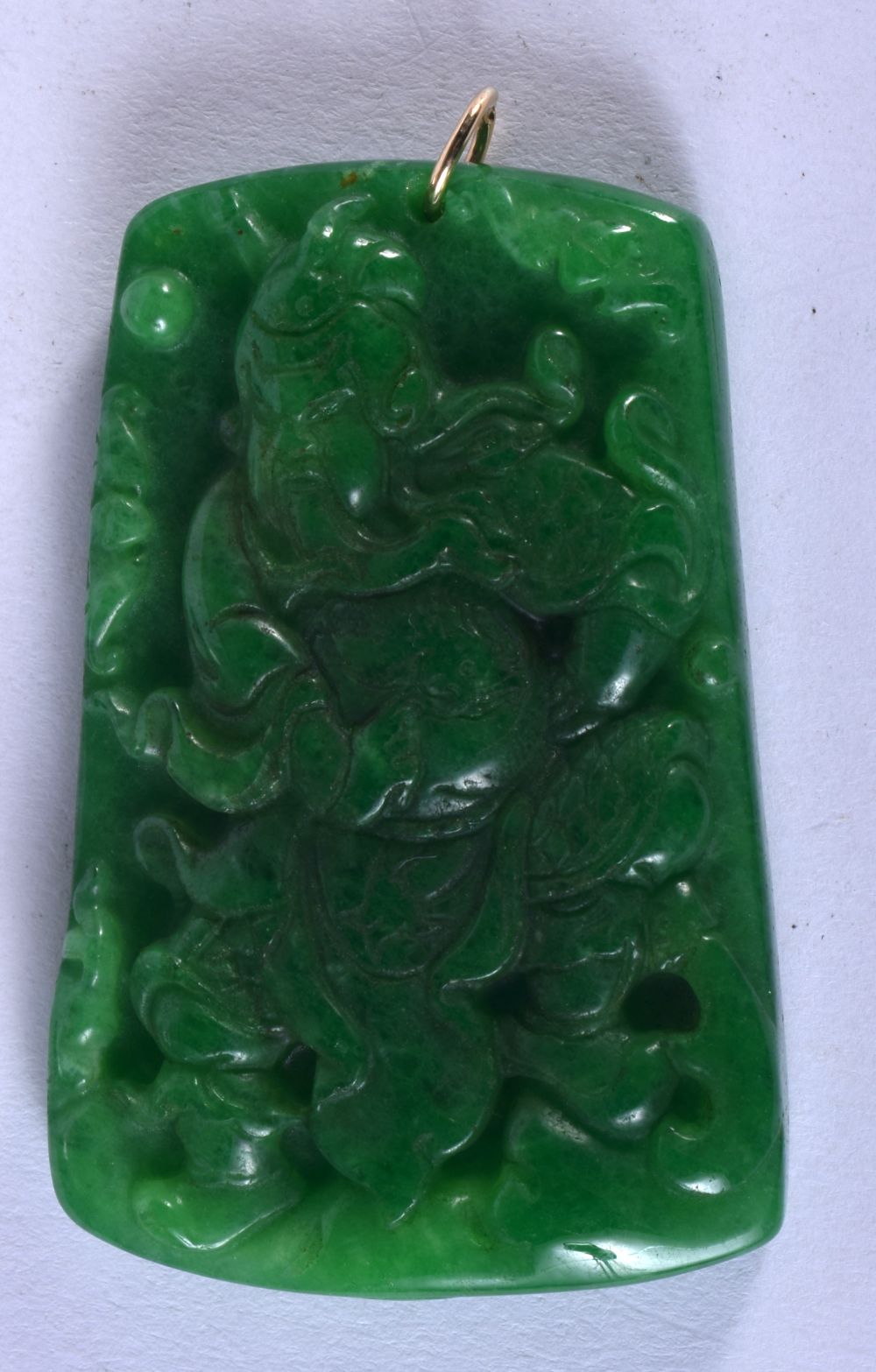 A CHINESE JADE PENDANT CARVED WITH AN IMMORTAL. 6.4cm x 4.2cm, weight 42g