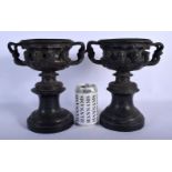 A PAIR OF 19TH CENTURY EUROPEAN TWIN HANDLED GRAND TOUR WARWICK VASES upon marble bases. 25 cm x 18