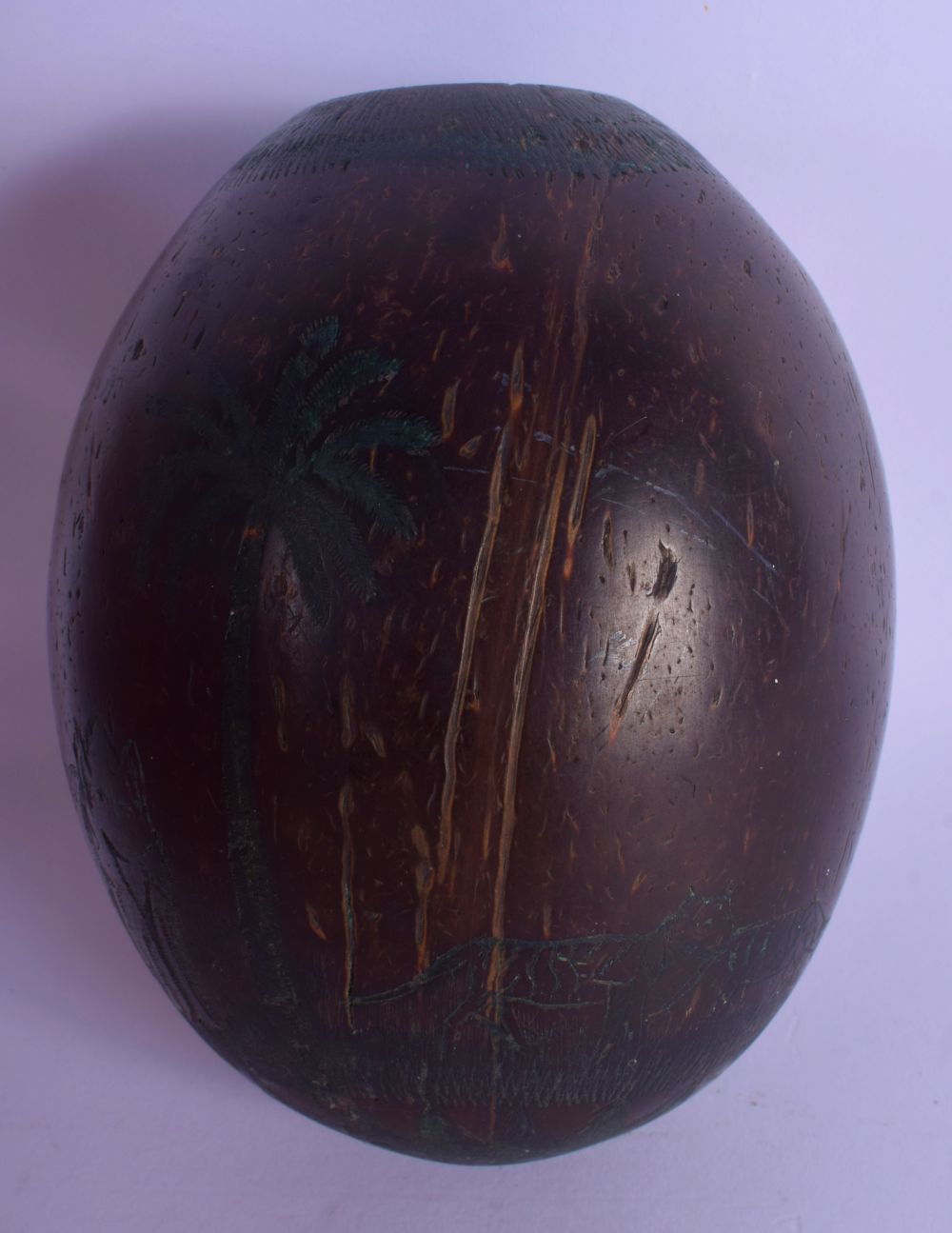 A 1920S SOUTH AMERICAN CARVED COCONUT BUGBEAR SHELL decorated with figures in various pursuits. 11 c - Image 3 of 5