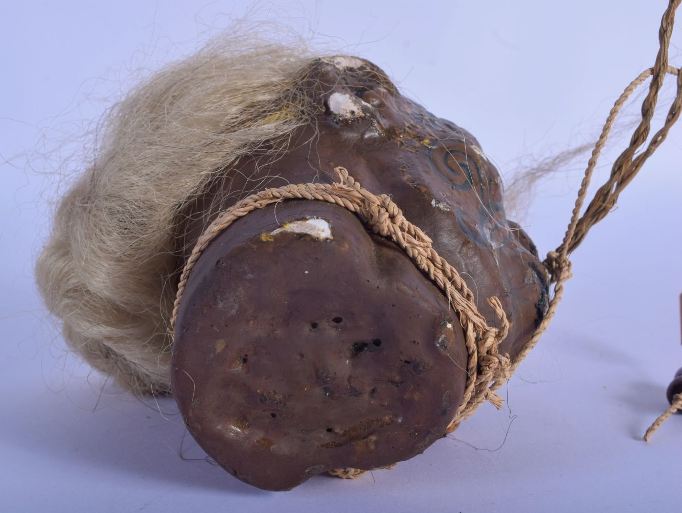 A VERY RARE EARLY 20TH CENTURY TRIBAL WAX TREE GUM SHRUNKEN HEAD decorated with tattoos. 20 cm x 12 - Image 4 of 4