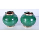 A pair of glazed terracotta jars with white metal mounts 13 x 13cm.