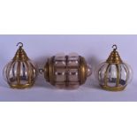 THREE CHARMING EARLY 20TH CENTURY BRASS MOUNTED GLASS LANTERNS of stylised bubble form. Largest 25 c