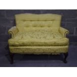 A antique two seater upholstered Sofa 95 x 138 x 94 cm.