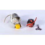 A small vintage wind up tin toy Piranha together with a wind up toy cat largest 11cm (2).