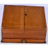 An antique light oak stationary box 29 x 39 x 22 cm