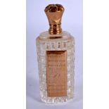 A GOLD TOPPED SCENT BOTTLE. 8.6cm x 3.2cm, weight 45.3g