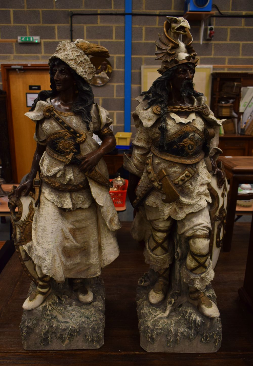 A FINE MONUMENTAL RARE PAIR OF EARLY 20TH CENTURY AUSTRIAN COLD PAINTED TERRACOTTA WARRIORS possibly