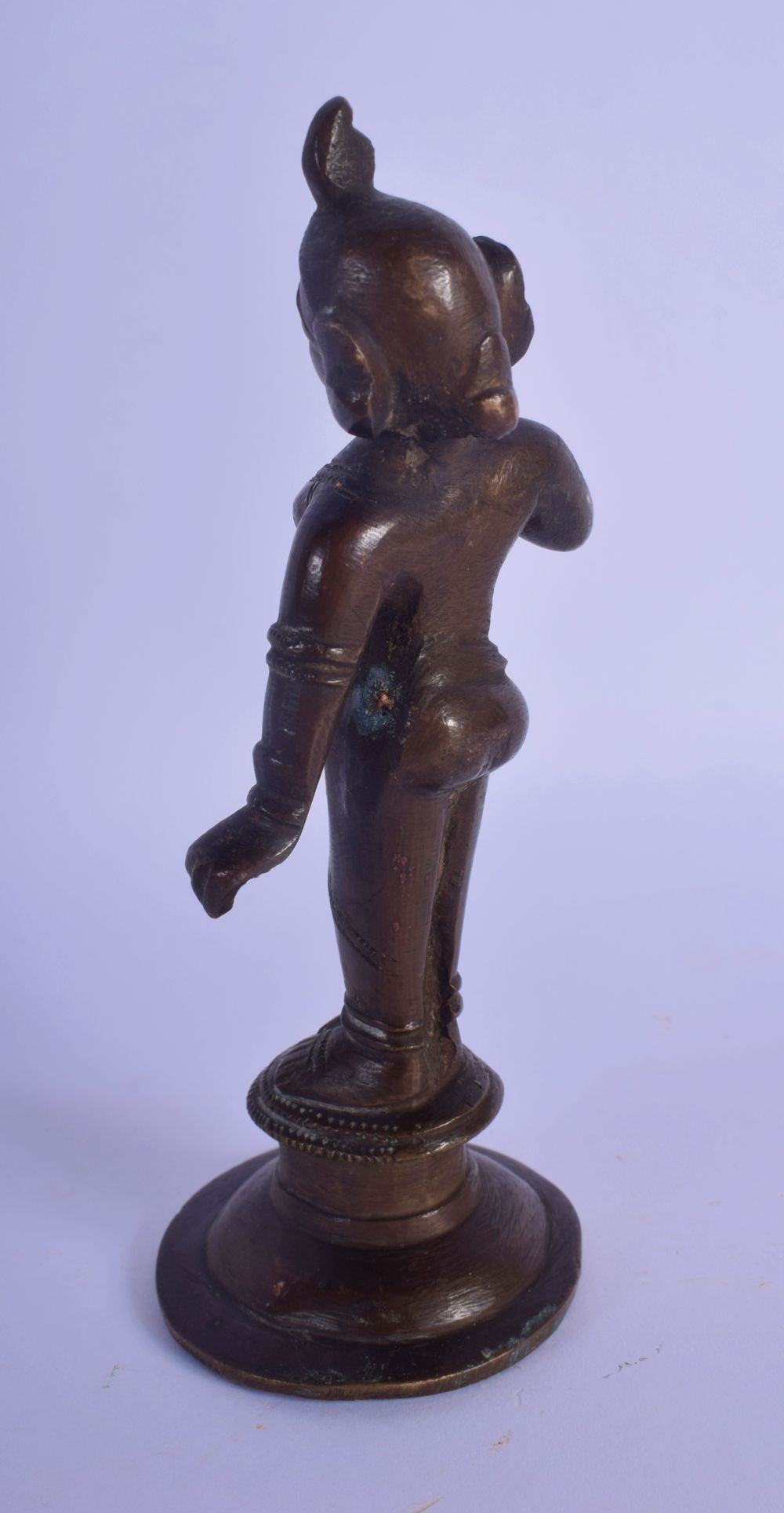 AN 18TH/19TH CENTURY INDIAN BRONZE FIGURE OF A BUDDHA modelled with one hand raised, with red paint - Image 2 of 4