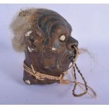 A VERY RARE EARLY 20TH CENTURY TRIBAL WAX TREE GUM SHRUNKEN HEAD decorated with tattoos. 20 cm x 12