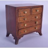 AN ANTIQUE APPRENTICE MADE IVORY HANDLED MINIATURE CHEST OF DRAWERS possibly a salesman sample. 16 c