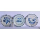 THREE LARGE 18TH CENTURY DELFT BLUE AND WHITE CHARGERS painted with flowers and landscapes. 34 cm di