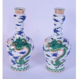 A pair of Chinese polychrome vases decorated with dragons and clouds 28 cm (2).