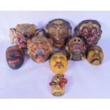 A collection of South Eastern Asian masks (9).