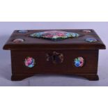 AN ART DECO CARVED WOOD AND ENAMELLED CASKET painted with floral sprays. 20 cm x 12 cm.