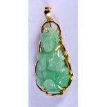 A GOLD MOUNTED JADE BUDDHA PENDANT. 3.9cm x 1.6cm, weight 5.1g