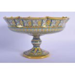 A 19TH CENTURY ITALIAN TIN GLAZED FAIENCE CANTAGALLI PEDESTAL TAZZA painted with a leaping deer amon