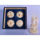 AN EARLY 20TH CENTURY CHINESE CARVED IVORY PUZZLE BALL C1920 together with three spare balls. 14 cm