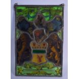 AN ANTIQUE STAINED GLASS WINDOW PANEL depicting masks, armorials and squirrels. 37 cm x 24 cm.