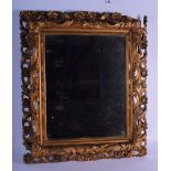 A FINE ANTIQUE CARVED FLORENTINE INSPIRED ENGLISH GILT WOOD FRAMED MIRROR by James Wyatt. 66 cm x 56