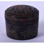 A 19TH CENTURY CHINESE CARVED HORN GAMING BOX AND COVER with counters. 3.25 cm diameter.